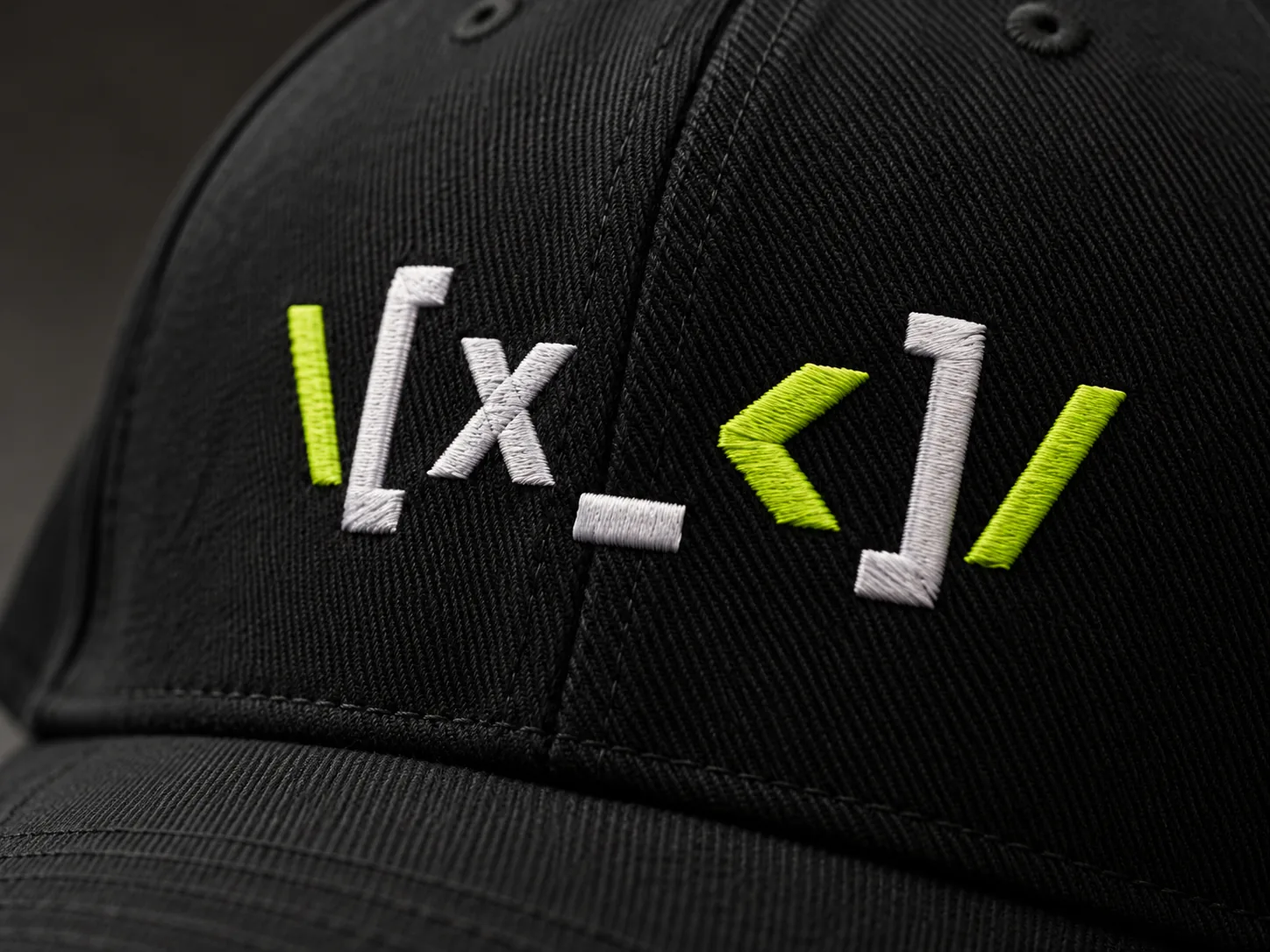 MERCH KUTONI embroidered logo on a black baseball cap, macro